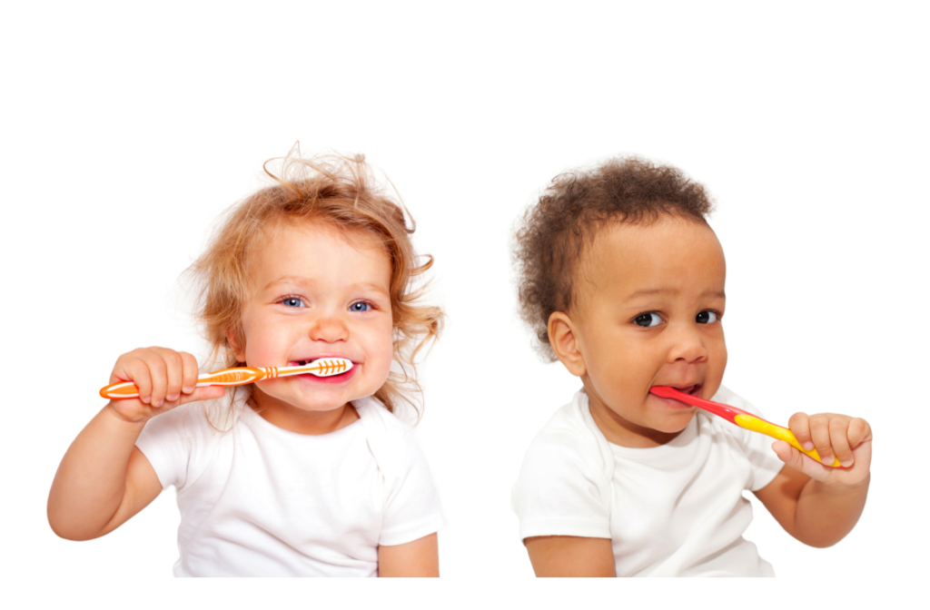 Two happy babies holding toothbrushes while brushing teeth